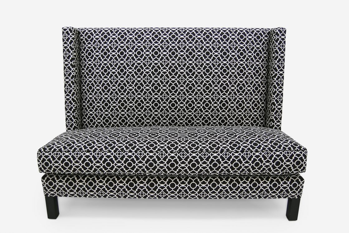 ROOM Mechiche Sofa / Banquette in black and white with kiln-dried hardwood frame with customizable waterfall skirt cushion fill, seam style, and leg finish made to order custom ROOM Furniture