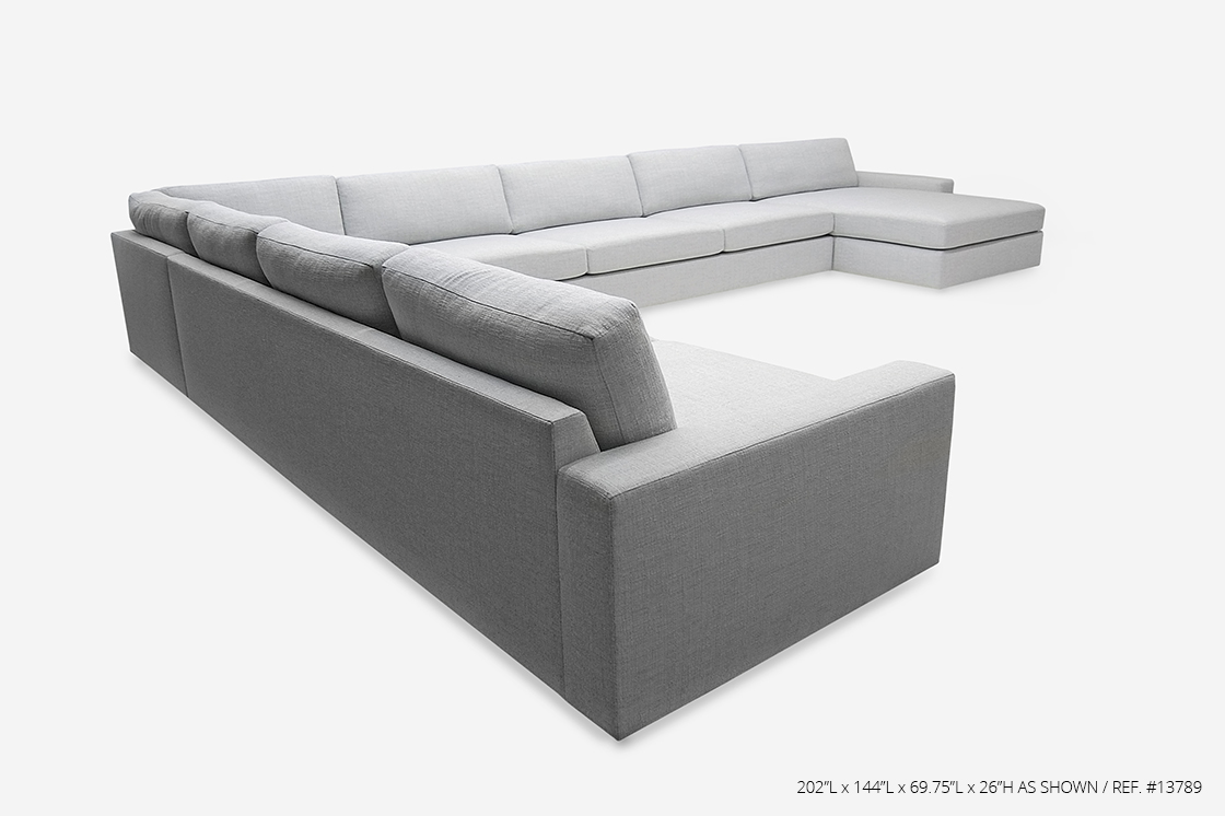 ROOM Vienne Sectional with white cushions and upholstery, flat seams, Kiln-dried hardwood frame, and inset plinth base fully customizable made to order custom ROOM Furniture