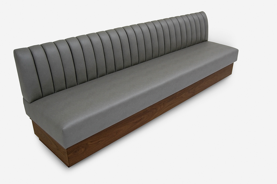 Niall Banquette tight back with vertical channels rectangular wood base walnut ply straight cut base with custom staining Room online Room Furniture